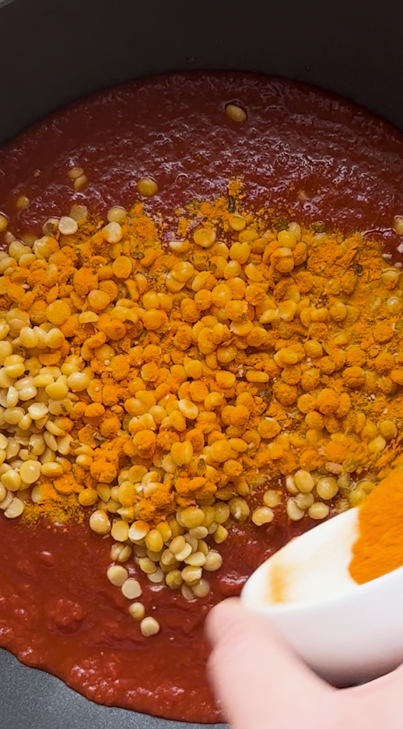 sauce prepped for Mantu topping with split yellow peas and seasonings